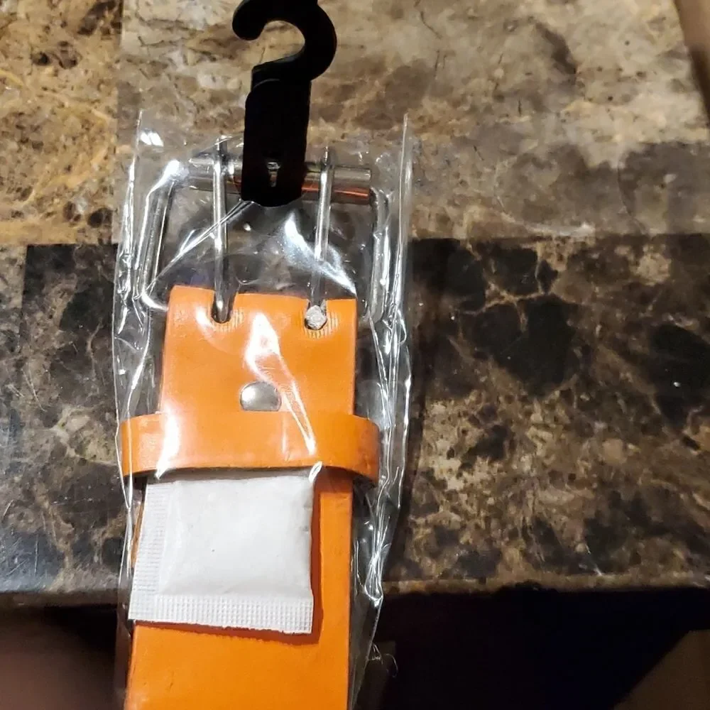 1.5 inch wide orange riveted belt